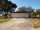 Single car garage with driveway and landscaping at 4131 Yorketowne Rd, Orlando, FL 32812