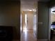 Interior hallway with tile flooring and doors to rooms at 4131 Yorketowne Rd, Orlando, FL 32812