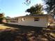 Ranch-style home with a large yard and screened porch at 4131 Yorketowne Rd, Orlando, FL 32812