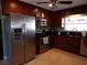 Modern kitchen features stainless steel appliances and dark wood cabinets at 4131 Yorketowne Rd, Orlando, FL 32812