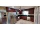 Updated kitchen featuring stainless steel appliances, dark granite countertops, and cherry cabinets at 4131 Yorketowne Rd, Orlando, FL 32812