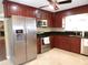 Kitchen featuring stainless steel appliances, granite countertops, and cherry cabinets at 4131 Yorketowne Rd, Orlando, FL 32812