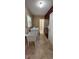 Laundry room with utility sink, washer, dryer and cherry cabinetry with lots of storage at 4131 Yorketowne Rd, Orlando, FL 32812