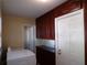 This laundry area features modern appliances and ample cabinet storage to make chores manageable at 4131 Yorketowne Rd, Orlando, FL 32812