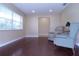 Bright living room with hardwood floors, a large window, and comfortable seating at 4131 Yorketowne Rd, Orlando, FL 32812
