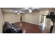 Expansive living area with hardwood floors, fireplace, and comfortable leather seating at 4131 Yorketowne Rd, Orlando, FL 32812