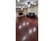 Spacious living room with hardwood floors, fireplace, recessed lighting, and ceiling fans at 4131 Yorketowne Rd, Orlando, FL 32812