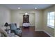 A bright living room featuring hardwood floors, neutral paint, and natural light at 4131 Yorketowne Rd, Orlando, FL 32812