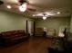 Large living room with hardwood floors and multiple seating areas at 4131 Yorketowne Rd, Orlando, FL 32812