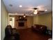 Living room with fireplace, hardwood floors, and leather furniture at 4131 Yorketowne Rd, Orlando, FL 32812