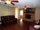 Living room with fireplace, hardwood floors, and leather furniture at 4131 Yorketowne Rd, Orlando, FL 32812