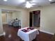 Open living space with dining area, chairs, and view of the kitchen at 4131 Yorketowne Rd, Orlando, FL 32812