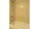 Shower with tan tiling and a white bathtub at 4131 Yorketowne Rd, Orlando, FL 32812