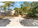 Landscaped backyard with concrete patio and picnic table at 436 E Jersey St, Orlando, FL 32806