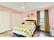 Cozy bedroom with a queen-size bed and soft color palette at 436 E Jersey St, Orlando, FL 32806