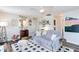 Living room with gray couch and checkered rug at 436 E Jersey St, Orlando, FL 32806