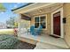 Front porch with blue chairs and lattice detail at 436 E Jersey St, Orlando, FL 32806