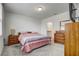 Main bedroom with a queen bed, nightstands, and a dresser at 4451 Rapallo Ave, Winter Haven, FL 33884