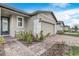 Landscaped front yard with brick pavers leading to the front door at 4451 Rapallo Ave, Winter Haven, FL 33884