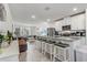 Modern kitchen with stainless steel appliances and an island at 4451 Rapallo Ave, Winter Haven, FL 33884