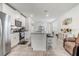 Modern kitchen with white cabinets, granite countertops, and stainless steel appliances at 4451 Rapallo Ave, Winter Haven, FL 33884