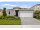 Charming single-story home with a manicured lawn and a two-car garage at 507 Silver Palm Dr, Haines City, FL 33844