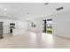 Bright open floor plan, connecting the kitchen, dining, and living areas at 507 Silver Palm Dr, Haines City, FL 33844