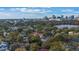 Aerial view of a home with city skyline in the distance and a lake nearby at 512 E Gore St, Orlando, FL 32806