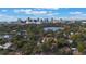 Aerial view showing a house with a city skyline and lake in the background at 512 E Gore St, Orlando, FL 32806