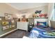 bedroom with twin bed, dresser and construction-themed decor at 512 E Gore St, Orlando, FL 32806