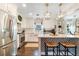 Modern kitchen features white shaker cabinets and a large island at 512 E Gore St, Orlando, FL 32806