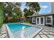 Inviting rectangular swimming pool with patio and fence at 512 E Gore St, Orlando, FL 32806