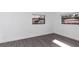 Well-lit bedroom featuring grey flooring and a fresh coat of paint at 520 Sw 38Th St, Ocala, FL 34471