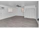 Spacious bedroom with gray flooring, ceiling fan, and white closet at 520 Sw 38Th St, Ocala, FL 34471