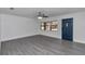 Spacious living room featuring gray laminate flooring and a ceiling fan at 520 Sw 38Th St, Ocala, FL 34471