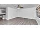 Living room with gray laminate floors and a view into the kitchen at 520 Sw 38Th St, Ocala, FL 34471