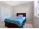 Charming bedroom with a built-in dresser and window at 5317 Jubiloso Dr, St Cloud, FL 34771