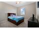 Bright bedroom featuring a twin bed, dresser, and window at 5317 Jubiloso Dr, St Cloud, FL 34771