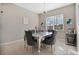 Elegant dining room with a silver table and gray chairs at 5317 Jubiloso Dr, St Cloud, FL 34771