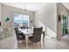 Bright dining room with table and chairs, natural light, and modern lighting fixture at 5317 Jubiloso Dr, St Cloud, FL 34771