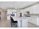 Modern kitchen with white cabinets, stainless steel appliances, and an island at 5317 Jubiloso Dr, St Cloud, FL 34771