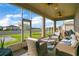 Relaxing screened porch with wicker furniture, overlooking backyard at 5317 Jubiloso Dr, St Cloud, FL 34771