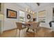 Bright dining area with a wood table, neutral chairs, and large windows at 5390 Nw 43Rd St, Ocala, FL 34482