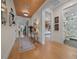 Light-filled hallway showcasing hardwood floors and access to multiple rooms at 5390 Nw 43Rd St, Ocala, FL 34482