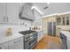 Modern kitchen with stainless steel appliances and white cabinetry at 5390 Nw 43Rd St, Ocala, FL 34482