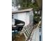 Backyard with shed, grill, ladders and building materials at 6111 Bamboo Dr, Orlando, FL 32807