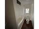 Bathroom with tub, shower, and toilet; needs minor updating at 641 W Beresford Rd, Deland, FL 32720