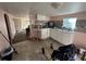 Simple kitchen with white cabinets and tiled floor at 641 W Beresford Rd, Deland, FL 32720