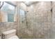 Small bathroom with walk-in shower and tiled walls at 8045 Happy Trl, Kissimmee, FL 34747