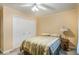 Cozy bedroom with double bed, built-in closet, and tiled floor at 8045 Happy Trl, Kissimmee, FL 34747